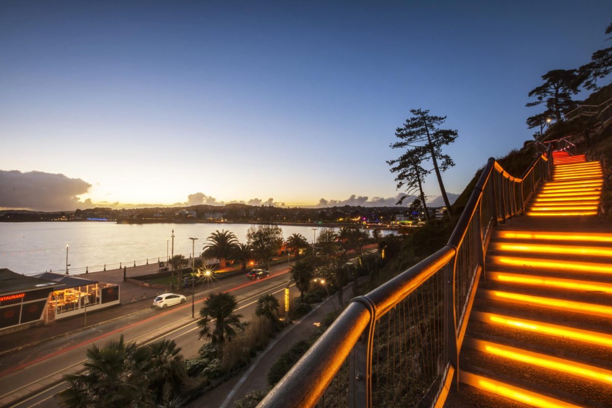 Torquay's Rock Walk lit up on an Autumn evening with views out to sea