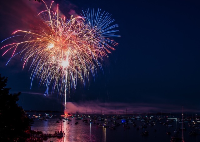 A dazzling finale: Dartmouth Regatta’s spectacular fireworks reflected beautifully in the River Dart, creating an unforgettable riverside show.
