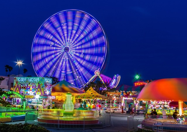 A magical evening at Westpoint Exeter Charity Fireworks Display — the funfair lights up the night before the big show begins.