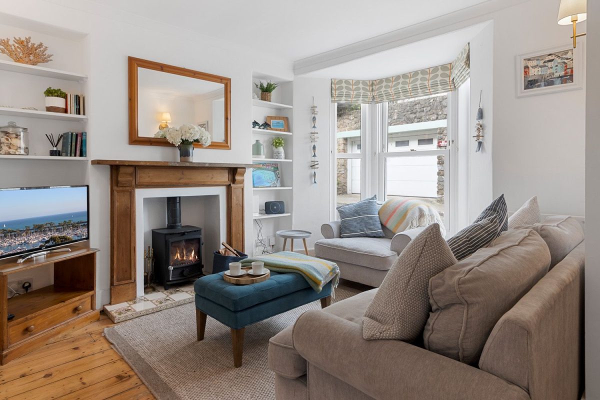 Cosy lounge with a log fire and plush furnishings