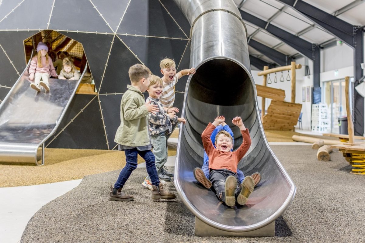 Children enjoying an indoor play area at Occombe Farm in South Devon