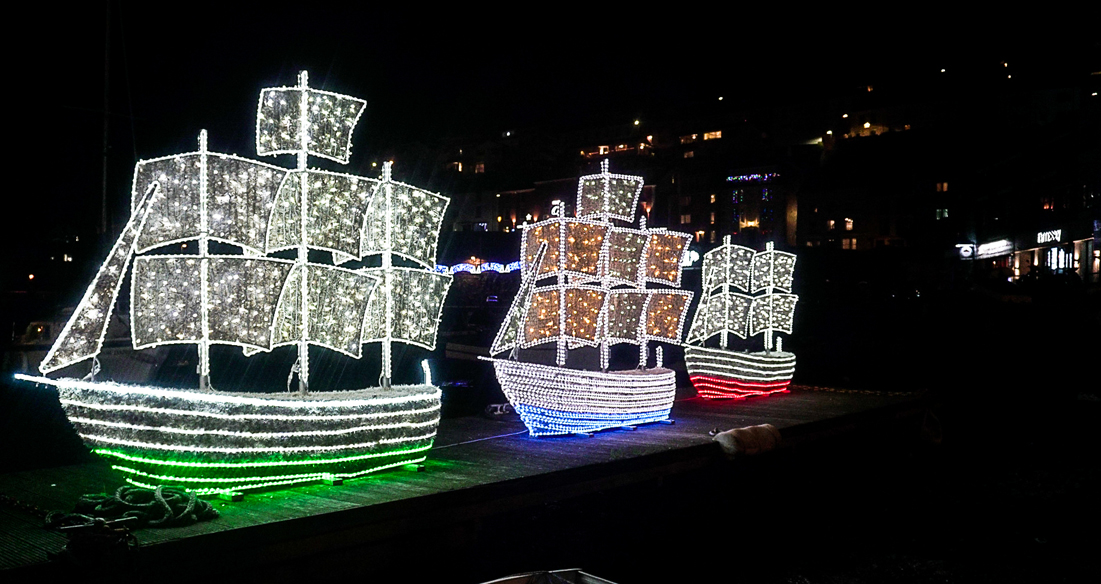 Brixham boats lit up with Christmas lights in Brixham harbour