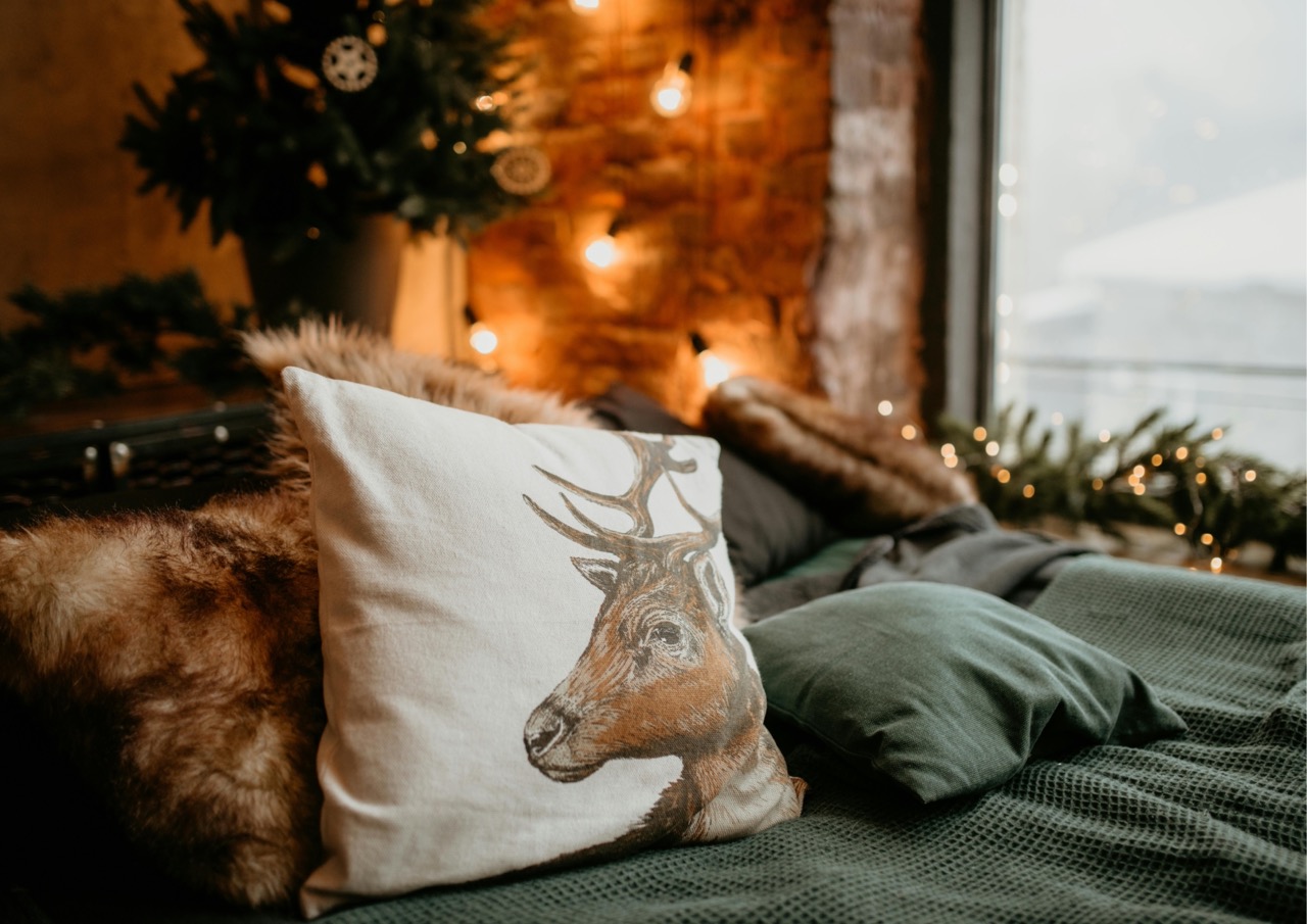 Cosy bed with extra pillows and blankets ready to welcome guests during the autumn/winter period