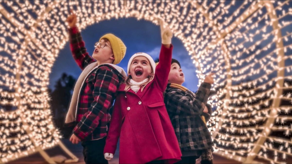 Children enjoying a light tunnel during the bay of lights in South Devon