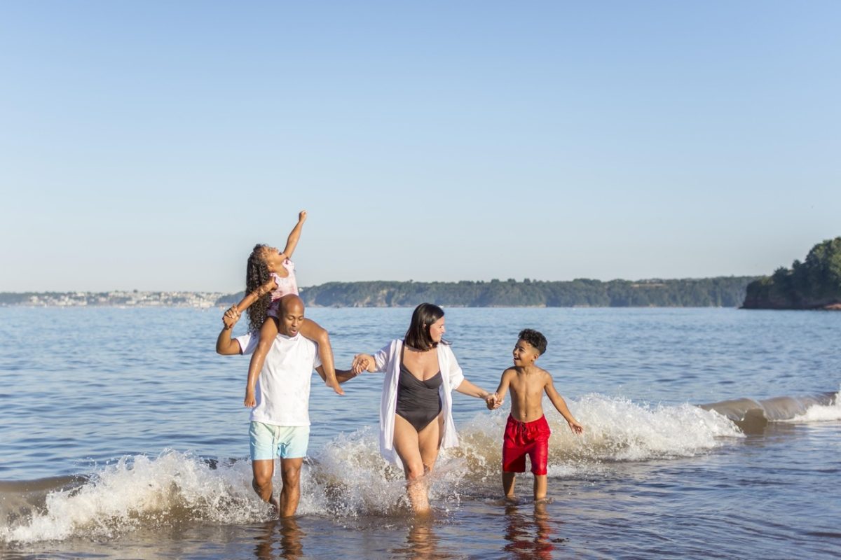 Family enjoying a 2026 Devon holiday on Paignton Beach