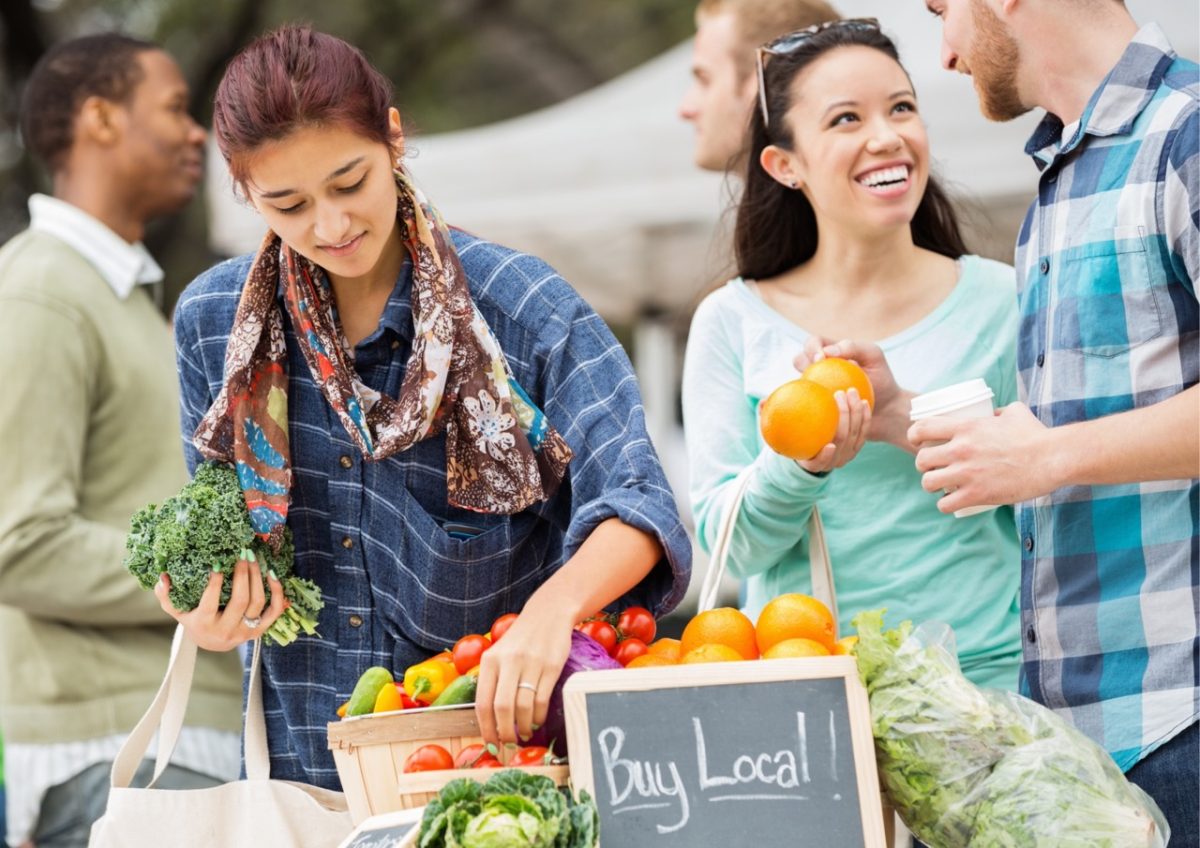 People buying fresh produce at a South Devon farmer's market